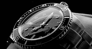 A luxury watch displayed against a sleek black background, highlighting its intricate design and craftsmanship.